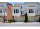 Exterior view of townhome with garage, white siding, and multiple windows at 623 Brennan Dr, Decatur, GA 30033