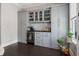 Coffee bar area in kitchen includes gray cabinets, a wine cooler, and counter space at 623 Brennan Dr, Decatur, GA 30033