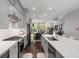 Open-concept kitchen showcases gray cabinets, quartz countertops, and stainless steel appliances at 623 Brennan Dr, Decatur, GA 30033