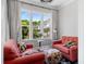 Cozy seating area features comfortable chairs and large windows with natural light at 623 Brennan Dr, Decatur, GA 30033