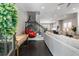 Bright, open-concept living room with dark hardwood floors, stylish furniture, and staircase access at 623 Brennan Dr, Decatur, GA 30033