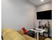 Cozy living room area with olive sofa, shelving, and a large TV for entertainment at 623 Brennan Dr, Decatur, GA 30033