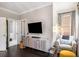 Bright bedroom featuring a large TV and a comfortable seating area at 623 Brennan Dr, Decatur, GA 30033