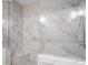 Stunning walk-in shower features sleek marble tile and glass surround at 623 Brennan Dr, Decatur, GA 30033