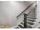 Modern staircase with dark wood treads and black iron railing at 623 Brennan Dr, Decatur, GA 30033