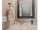 Clean bathroom featuring a white vanity and decorative mirror at 3444 Washington Way, Atlanta, GA 30340