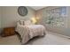 Comfortable bedroom featuring a window with natural light and neutral wall color at 3444 Washington Way, Atlanta, GA 30340