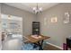 Dining area with chandelier and views of the living room and backyard at 3444 Washington Way, Atlanta, GA 30340