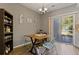Dining area features sliding glass doors to backyard and modern lighting at 3444 Washington Way, Atlanta, GA 30340