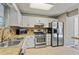 Bright kitchen with stainless steel appliances, tile backsplash, and modern cabinetry at 3444 Washington Way, Atlanta, GA 30340