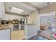 Kitchen with stainless steel appliances and breakfast bar, open to living area at 3444 Washington Way, Atlanta, GA 30340