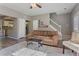 View of living room leading to kitchen with staircase in the background at 3444 Washington Way, Atlanta, GA 30340