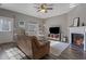 Inviting living room with fireplace, ceiling fan and wood-look floors at 3444 Washington Way, Atlanta, GA 30340