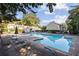 Community pool featuring several lounge chairs, umbrellas, and tables at 3444 Washington Way, Atlanta, GA 30340