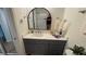 Updated bathroom with vanity, storage, mirror, and modern decor at 5674 Kingsport Dr # 4, Atlanta, GA 30342