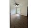 Bedroom with hardwood floors and bright window overlooking the backyard at 5674 Kingsport Dr # 4, Atlanta, GA 30342