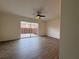 Spacious living room with hardwood floors and a sliding glass door leading to the outdoor patio at 5674 Kingsport Dr # 4, Atlanta, GA 30342