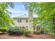 View of the back of the home with a screened-in porch and deck area, perfect for enjoying the outdoors at 5767 Wembley Dr, Douglasville, GA 30135