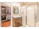 Bathroom featuring closet, shower, and a vanity with countertop space at 5767 Wembley Dr, Douglasville, GA 30135