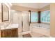Bathroom featuring a shower, soaking tub, and a vanity with countertop at 5767 Wembley Dr, Douglasville, GA 30135