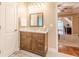 Bathroom featuring vanity with natural light, and access to an office area at 5767 Wembley Dr, Douglasville, GA 30135