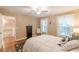 Bedroom with white bedding, wood floors and lots of natural light at 5767 Wembley Dr, Douglasville, GA 30135