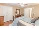 Spacious bedroom featuring hardwood floors, neutral paint, closet and view to hallway at 5767 Wembley Dr, Douglasville, GA 30135