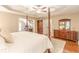 Well-lit bedroom with hardwood floors, a ceiling fan, and a view to an office at 5767 Wembley Dr, Douglasville, GA 30135