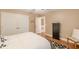 Bedroom with white bedding, wood floors, double door closets and natural light at 5767 Wembley Dr, Douglasville, GA 30135
