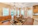 Dining area adjacent to the kitchen and patio, featuring a wood table and chairs at 5767 Wembley Dr, Douglasville, GA 30135