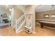 Inviting foyer with hardwood floors and staircase leading to the upper level at 5767 Wembley Dr, Douglasville, GA 30135