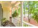 Charming front porch with ferns and wood floors for relaxing and enjoying the outdoors at 5767 Wembley Dr, Douglasville, GA 30135