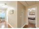Hallway leading to bedrooms with hardwood floors and neutral paint at 5767 Wembley Dr, Douglasville, GA 30135