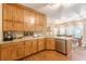 Gourmet kitchen featuring granite countertops, stainless steel appliances, and stylish wooden cabinetry at 5767 Wembley Dr, Douglasville, GA 30135