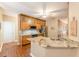 Open kitchen with granite counters, wood cabinets, and stainless steel appliances at 5767 Wembley Dr, Douglasville, GA 30135