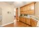 Spacious kitchen with wood cabinets, granite counters and stainless steel sink at 5767 Wembley Dr, Douglasville, GA 30135