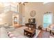 Bright living room with high ceilings, hardwood floors, and ample natural light at 5767 Wembley Dr, Douglasville, GA 30135