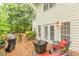 Spacious wooden deck with outdoor seating and a grill, perfect for summer barbecues at 5767 Wembley Dr, Douglasville, GA 30135