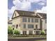Three-story brick townhouse features dark-trimmed windows, a small balcony, and professional landscaping at 205 Mayfair Ct, Alpharetta, GA 30009