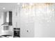 Close-up of a modern kitchen with a unique chandelier at 205 Mayfair Ct, Alpharetta, GA 30009