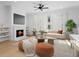 Bright living room boasts fireplace, hardwood floors, and neutral decor, creating a cozy and inviting atmosphere at 205 Mayfair Ct, Alpharetta, GA 30009
