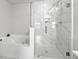 Bathroom showcasing a soaking tub adjacent to a walk-in shower with elegant tile work at 2766 Wander Ln, Alpharetta, GA 30022