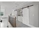 Convenient upstairs laundry area with modern washer and dryer, and storage space at 2766 Wander Ln, Alpharetta, GA 30022