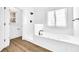 Modern bathroom features stand up shower and deep soaking tub with jets at 3110 Haverhill Ne Cv, Conyers, GA 30012