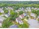 A neighborhood with houses featuring mature trees, well-kept lawns, and a cul-de-sac street at 3623 Thurleston Sw Ct, Marietta, GA 30008