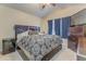 Bedroom with ceiling fan, natural light, and comfortable furnishings at 3623 Thurleston Sw Ct, Marietta, GA 30008