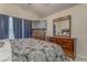 Comfortable bedroom setup with ceiling fan, TV and dresser at 3623 Thurleston Sw Ct, Marietta, GA 30008