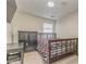 Cozy bedroom features a large bed, desk, television, and closet with carpet flooring at 3623 Thurleston Sw Ct, Marietta, GA 30008