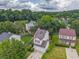 Two-story home with an attached two car garage, lawn, and a wooded area in the background at 3623 Thurleston Sw Ct, Marietta, GA 30008