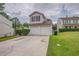 Charming two-story home with a two-car garage, landscaped yard, and inviting curb appeal at 3623 Thurleston Sw Ct, Marietta, GA 30008